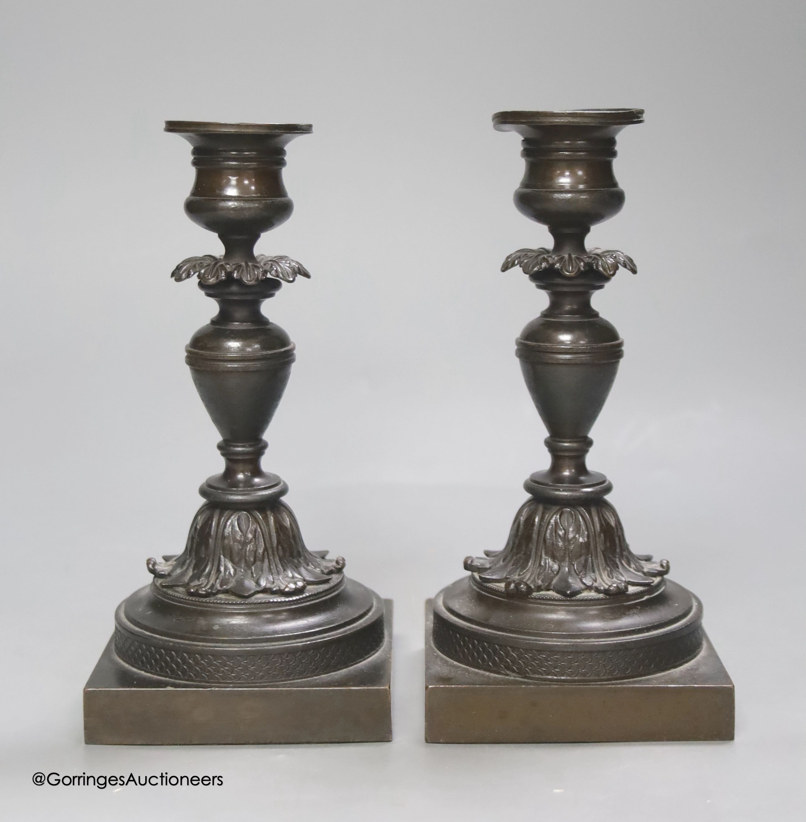 A pair of 19th century French bronze dwarf candlesticks, height 17cm